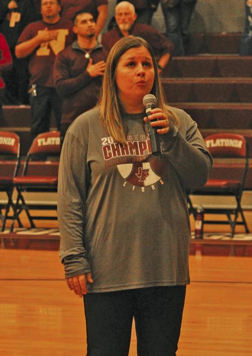 When the sound system wasn’t working at the Flatonia gym before the basketball playoff game there, Flatonia ISD’s Robin Branecky asked for volunteers to sing the National Anthem. Fayetteville principal Brynn Lopez answered the call and wowed the gym with her rendition of the song. Photo by Jeff Wick