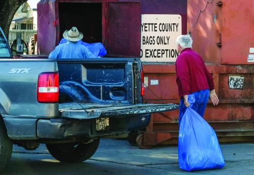 “We’re seeing every bit of two-and-a-half tons more every week in trash,” said Recycling Center manager Paul Zapalac. “Before, we’d normally see 10 tons a week. Now it has increased at least 20 percent.” Photo by Andy Behlen