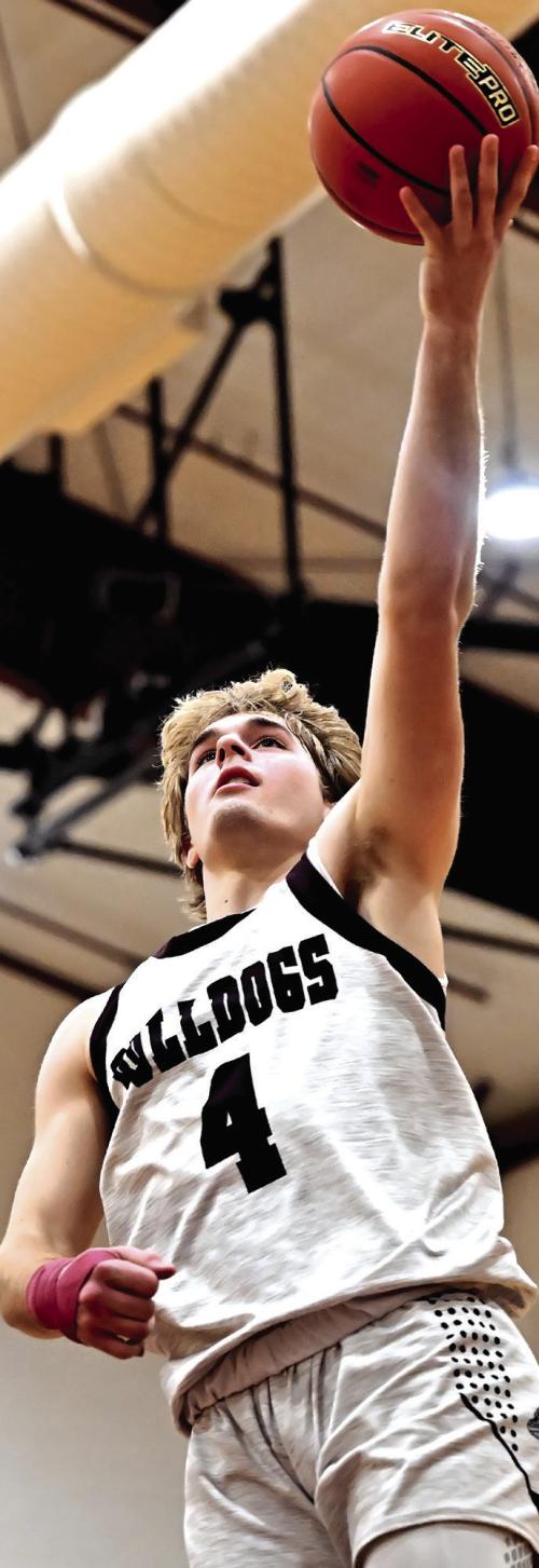 Holden Kloesel goes up for the shot Tuesday night in Flatonia where the Bulldogs defeated the Weimar Wildcats. Photo by Stephanie Steinhauser