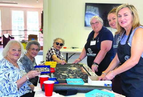 Puzzle addicts in Flatonia just won’t quit. From left: Laverne Syler, Jeanette Zouzalik, Gretchen Zapalac, and volunteers Kathy Carpenter, Kandace Dalmolin and Kitty Wilbanks.