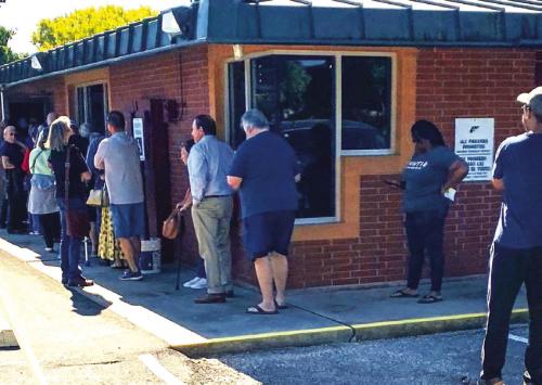 Turnout on the first day of early voting was especially high in Fayette County, with a line forming outside the elections office Monday morning.