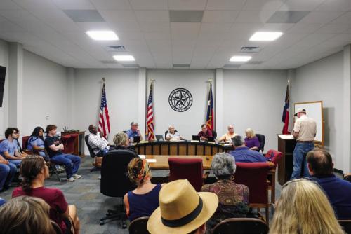 A big crowd attended the Schulenburg City Council meeting Monday night, Aug. 3, as City leaders decide how to proceed with the downtown city hall renovation project. Last month, the Council voted to go after $8 million in certificates of obligation to fund the project. But a petition to force a bond election on the matter has now been filed. Photo by Andy Behlen
