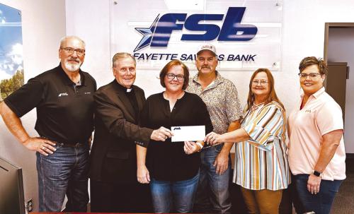Pictured from left: Mike Olle, FSB; Very Reverend Jasper Liggio, St. Rose of Lima Catholic Church Pastor; Misty and Colin Ohnheiser; Rosanne Gallia, St. Rose School Principal; Cheryl Brossmann, FSB Lobby Manager.