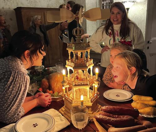 Attendees enjoying historic Christmas decorations inside the Kreische Home.