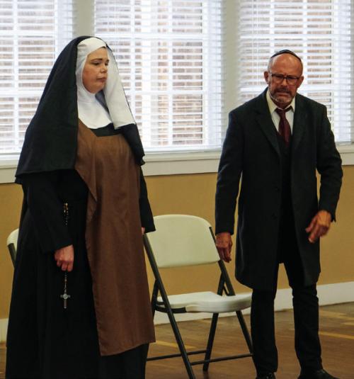 Kristen Holub as Prioress (left) and Aaron Rainey as Dr. Saul Weisman (right) rehearse their parts for Fayette County Community Theatre’s production of “Edith Stein.” Photo by Andy Behlen