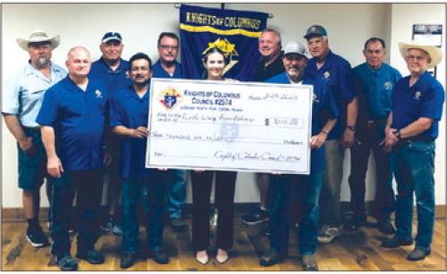 The Knights of Columbus Council No. 2574 presented Turtle Wing Foundation with a generous donation. The Knights of Columbus members in attendance from left: Richard Hoffmann, Marcus Recek, Randy Proske, Philip Rocha, Ralph Dunk, Charles Youngblood, Hector Cervantez, Pat Lyons, Gary Antosh, and Jim Kothmann. Also pictured in the center is the Executive Director of Turtle Wing Foundation, Destiny Psencik.
