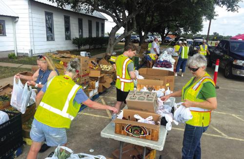 Locals Pass Out 7,813 Lbs. of Food in Waldeck
