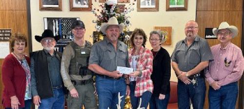 Hostyn KJT Society #3 presented a donation to the Fayette County Deputy Santa Program. This program brings the joy of Christmas to children and their families across the County. Pictured in the presentation were (from left) KJT Reporter Dianna Kallus, KJT Vice President Benedict Kallus, Deputy David Smith, Sheriff Keith Korenek, KJT Treasurer Brenda Fietsam, KJT Secretary Joyce Muras, Lt. David Beyer and Chief Deputy Randy Noviskie.