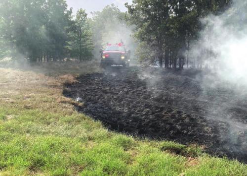 Above, firefighters work to contain a grass fire that started along Interstate 10 near Flatonia. Below, Schulenburg Police and Sheriff’s Deputies stopped a car for reckless driving and wound up arresting a woman on smuggling charges.