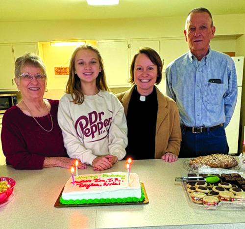 December birthdays were celebrated at St. John Lutheran during the Christmas brunch after worship on Sunday, Dec. 7. Pictured here are Annie Mueller, Brylee Brugger, Pastor Jen Kindsvatter, and JR Koehl.