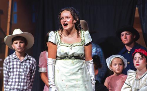 Hannah Garza sings a solo during Friday’s performance.