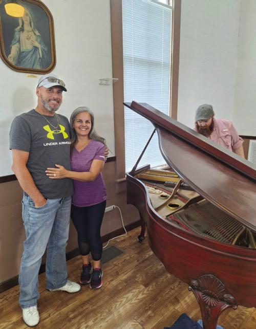 Roger and Vikki Warnken recently donated a piano to the Freyburg Methodust Church. The photo above their heads was donated to the church in the early years by Roger’s Great Aunt Mary Warnken.