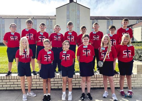 St. Rose of Lima Catholic School Fifth graders traveled to Vocation Awareness Day at Incarnate Word Convent in Victoria. They learned about missionary work, lifestyles of priests, brothers, sisters, and nuns, participated in a scavenger hunt in the hall of memories, visited the gift shop, and participated in a prayer service in the chapel. On the way back home, they took a private tour of the Diocese of Victoria Chancery from Monsignor John Peters.