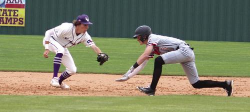 Cody Kruse tags out a stealing Gonzales baserunner.