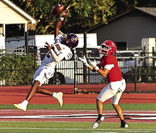 La Grange’s Howard “Skip” Holmes leaps high to bat away this pass attempt by Columbus during Friday’s game. Photo by Darrell D. Gest
