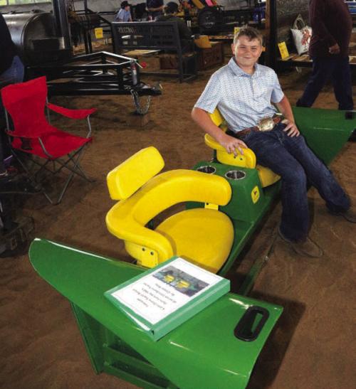 The Blinn College District Agricultural Sciences Program marked a major milestone with the 25th anniversary of its annual Ag Mechanics Show, welcoming nearly 300 entries and introducing a new award recognizing student excellence in showmanship. Class winners included Flatonia FFA in Class 1. Pictured here is Cooper Riley’s project was a John Deere tractor bench, made from parts of John Deere tractors from the 1960s. Riley is from the Round Top Carmine FFA.