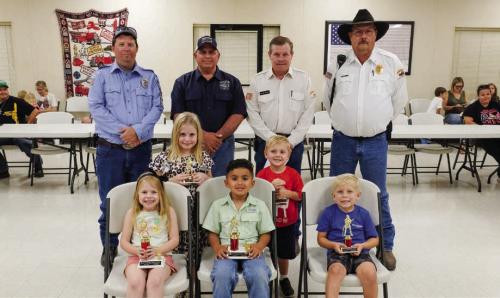 Winners in the Kindergarten Division (Pre-k and Kindergarden) went to (front, from left) First Place - Allie Neiser, Second Place - Emmanuel De Arcis, Third Place - Leighton Woods, (middle row) Honorable Mention - Paisley Guentert, Luke Hudec and (not pictured) Lochlan Stewart. Also pictured are (back row) Fayette County Firefighters Andrew Baker of Muldoon VFD, Quentin Riche of Schulenburg VFD, Calvin Krause of Round Top-Warrenton VFD and Keith Burcalow of Round Top-Warrenton VFD.