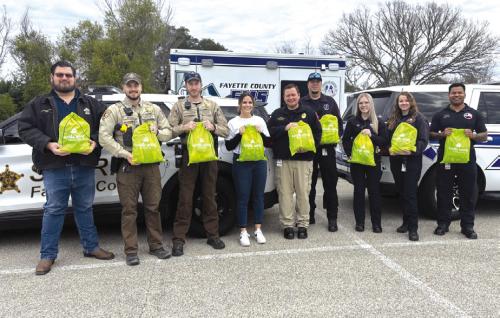 Pictured from left: Investigator Jeremy Castleberry, Deputy Jared Michalec, Deputy Wesly Arrison, Turtle Wing Executive Director Destiny Siptak, EMS Director Josh Vandever, Captain Jarrett Bise, EMT Kaitlyn Witt, Paramedic Taylor Spackman, and Asst. Director Gary Daniels.