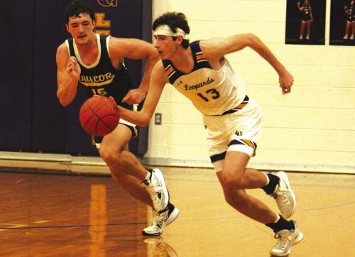 La Grange’s Jaxon Cooper dribbles down the court in Tuesday’s game against Taylor. Cooper scored 28 of the Leps’ 48 points. Photo by Jeff Wick