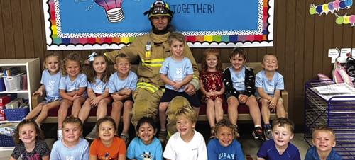 Local firefighter Josh Tiemann recently gave a talk to Mt. Calvary Lutheran Preschool students about fire safety.