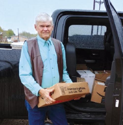 American Legion Post No. 338 Vice-Commander Marvin Wessels loads the food donations collected by the post and auxiliary during their meeting held on Dec. 5.