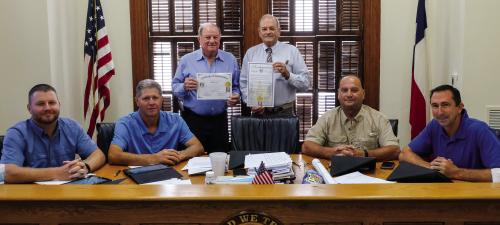 The Fayette County Commissioners Court signed a certificate of appreciation last Thursday, Sept. 8, recognizing Bob Heinrich for serving as Fayette County’s representative on the board of directors of Bluebonnet Trails Community Services. Pictured (from left) are Pct. 4 Commissioner Drew Brossmann, Pct. 3 Commissioner Harvey Berckenhoff, Heinrich, County Judge Joe Weber, Pct. 2 Commissioner Luke Sternadel and Pct. 1 Commissioner Jason McBroom. Photo by Andy Behlen