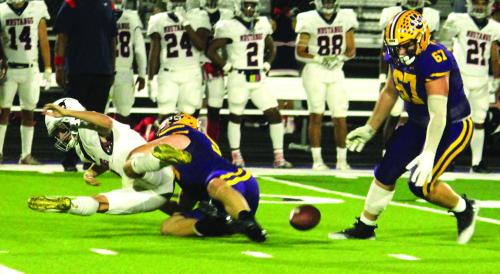 La Grange’s Anthony Weikel, center, tackles the Madisonville quarterback and forces a fumble which was picked up by Lep Cooper Imhoff, right. That turnover set up a Leps touchdown that would give them a brief 7-0 lead Thursday. Photo by Jeff Wick