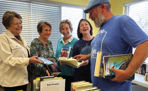 Friends of the Schulenburg Library members (left to right) Jenny Kubenka, Joyce Kobza, Diana Mikesky and Kristy Clark, offer reading recommendations to Kenneth Couch of Schulenburg on day one of their annual book sale. Drop by the Schulenburg Library this week and make your choices: Monday 10 a.m.-8 p.m., Tuesday-Friday 10 a.m.-6 p.m. or Saturday 9 a.m.-noon. Prices are reasonable and proceeds support the library. Photo by Elaine Thomas