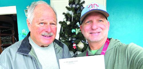 The Holy Smokers of St. James Episcopal Church in La Grange presented a special year end donation of $1,000 to the Serenity Star Recovery Program for Fayette/Bastrop Counties. Pictured from left: Holy Smoker Tom Tracy and Tuf Jones, Serenity Star Program Director.