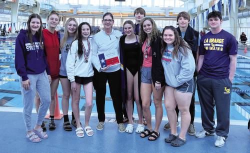 La Grange Swim Coach Gretchen Ledwik wins Best Female Coach of the Meet at Friday’s (January 20, 2023) UIL District 14-4A Swim Meet in San Antonio. La Grange Swim team placed second overall in the meet and will be advancing to Regionals. Pictured from Left to Right: Elena Supak, Quinlyn Landis, Hope Michalke, Eleanor Carey, Coach Gretchen Ledwik, Bailey Swisher, Dalton Landis, Campbell Youens, Avery Koehl, Collin Landis and Spencer Ingram. Photos by Katy Michalke