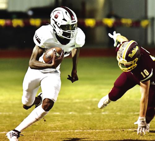 Flatonia’s Jaidyn Guyton breaks a tackle and runs 98 yards for a touchdown Friday night when the Flatonia Bulldogs traveled to Thorndale. Photo by Stephanie Steinhauser