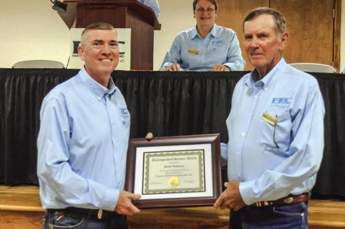 David Lehmann, director of District 1, retired from the board of directors after serving for 45 years. David is pictured at right receiving a distinguished service award from General Manager/ CEO Doug Lambert.