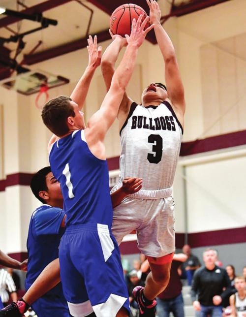 Flatonia’s Fidel Venegas goes up strong for the shot in a December victory over #5-ranked Dime Box. Photo by Stephanie Steinhauser