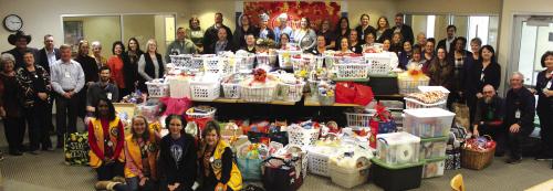 Some of the donors of more than 130 Thanksgiving meal baskets are shown here Thursday at St. Mark’s Medical Center. The baskets were heading to needy families in a four county area. Photos by Jeff Wick
