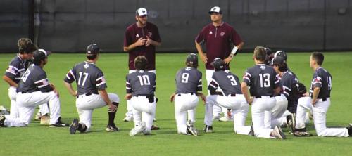 Fayetteville head coach Clint Jaeger talks to his team after Thursday’s playoff victory. Photo by Amy Fritsch