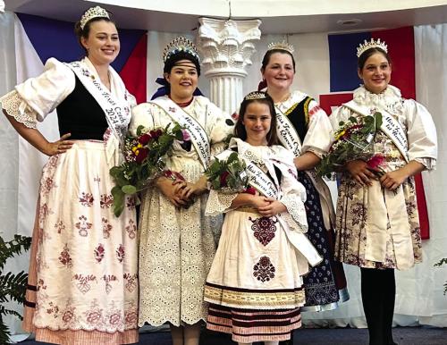 The full royalty court with Lillie Karstedt on front, and her older sister Madelyn, left, who is the outgoing Miss Texas Czech Slovak Queen.