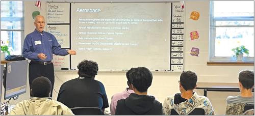Texas A&amp;M Engineering Department board member, Tim Pylant, speaks to Kim Newton's middle school students about STEM careers on Nov. 16.