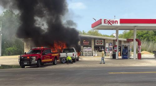 A shot of Monday’s fire after the burning truck had been pulled away from the store by La Grange Fire Chief Frank Menefee with the help of local carpenter Justin Coufal and other bystanders to protect the building. Photo by Andy Behlen