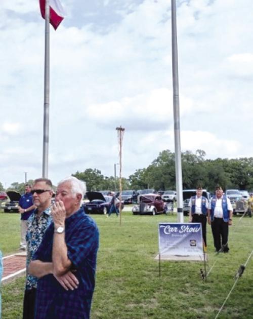 Schulenburg American Legion Post 143 raised the flag for the “Slavnost” May Fest on May 18 at the Texas Czech Heritage and Cultural Center in La Grange. Pictured in uniform near the flag pole is Sergeant at Arms Harry Bartosch and Adjutant Dennis Muhlstein. Not pictured is Commander Bob Heinrich, who lead the Pledge of Allegiance from the stage.