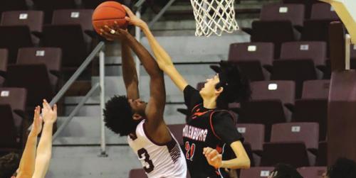 Schulenburg’s Alex Lozano blocks this shot by a Grapeland player in Tuesday night’s state semifinal. Photo by Audrey Kristynik