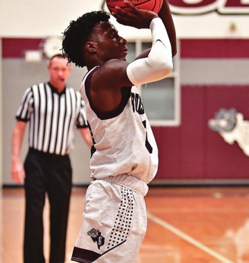 Keyshaun Green nails a three point shot in the 66-64 win over Dime Box on Dec. 21. Photo by Stephanie Steinhauser