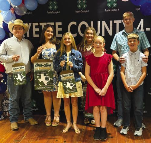 Pure Country 4-H Club posed after receiving their pins and awards from the preceding year. Pictured here is Rilan Karisch, Addison Eichler, Brylee Brugger, Rheagan Karisch, Abbie Eichler, Haygen Mings and Tucker Mings.