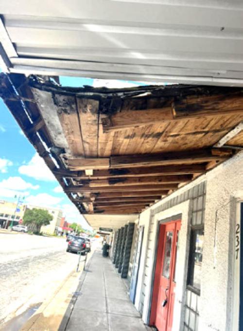 Rotten Awning on the Square Draws Attention