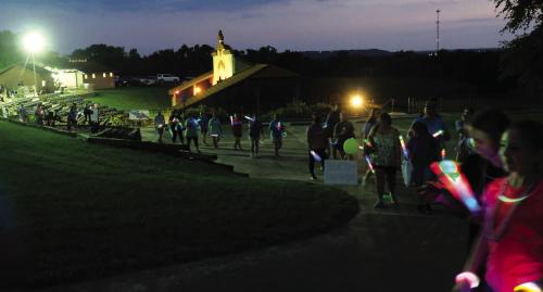 Part of Saturday’s event was a lighted walk around the Amphitheater grounds to raise awareness for suicide and mental health. Photos by Andy Behlen