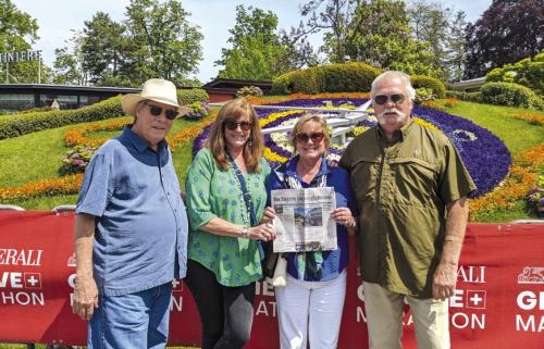 Charlie and Seri Davis and Frank and Linda Jones of La Grange took The Fayette County Record along when they were in Geneva, Switzerland. They are pictured standing in front of the world famous Flower Clock, created in 1955, the flowers change depending on the season.