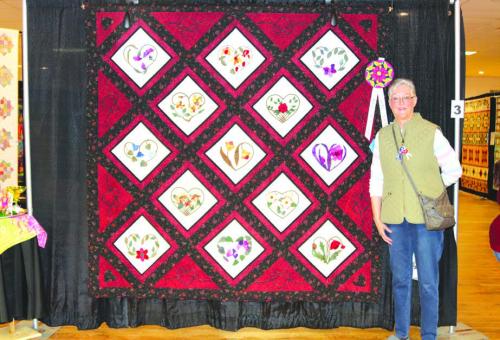 Best of Show - “Hearts and Flowers” by Brenda Perry, San Antonio.