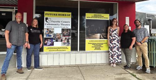Left to Right in front of the new theatre site: City Manager Jack Thompson , FCCT Executive Director Heather Barthelme, FCCT Operations Manager Melanie Lira, FCCT Board of Directors President Kristen Denham, Main Street Manager/Department of Community Development Supervisor Caleb Parks.
