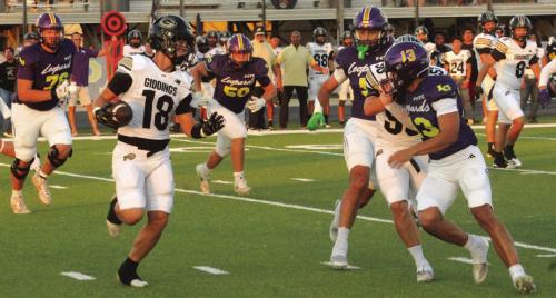 Giddings’ Colden Adams can’t find any running room as he is pursued by La Grange defensive players, left to right – Whitaker Samples, Luke Anderson, Chris Supak and Van Hill. Photo by Jeff Wick