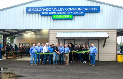 Representatives from the Fayette County Fair Association and Colorado Valley Communications, along with City of La Grange and Fayette County officials, cut the ribbon at the grand opening ceremony for the new Food Court at the Fairgrounds. Photo by Andy Behlen
