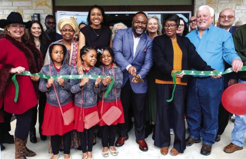 Kenneth Omoruyi, managing partner of CKO CPAs and Advisors, cuts the ribbon at the grand opening celebration of the firm’s new office in La Grange at 500 W. Travis St. Omoruyi recently took over the accounting firm of Schneider, Frazee and Matocha in La Grange. He is pictured above with his wife. Dr. Emma Omoruyi, and their triplets to his right, along with La Grange Mayor Jan Dockery and Vincent Matocha to his left.
